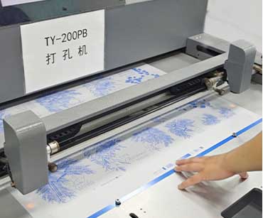 Printed sheets being handled at a machine
