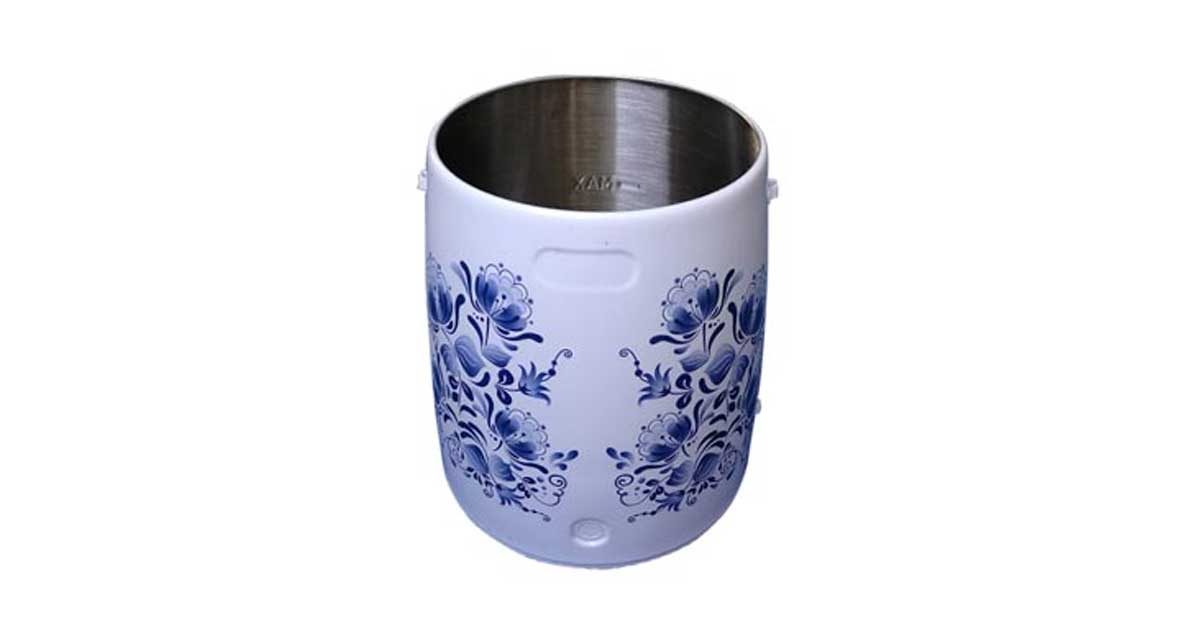 Blue floral water transfer decal graphics on a metal cup